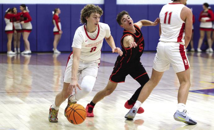 McLoud senior Bryce Cowns drives toward the goal in the Bethel First United Tournament game with Sallisaw on Dec. 12. The Redskins won that game, 55-52; lost to Eufaula on Dec. 13, 48-52; and beat Pauls Valley on Dec. 14, 50-37, to take third place in the tournament. Countywide &amp; Sun/Natasha Dunagan