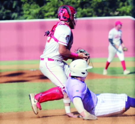 Dale senior and catcher Wyatt Seeley tags an Okarche runner out at home during the Dale Baseball Invitational Championship game with Okarche on Aug. 16.