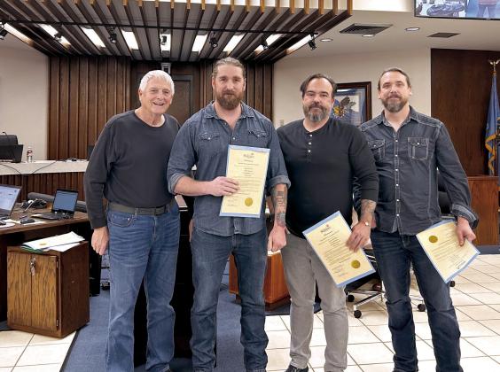 Mayor Ed Bolt (left) recognizes Outsider Productions and Play It Loud for their continued work in the film industry in the Shawnee area. Pictured from left are Bolt, Adam Hampton, Jason Alexander and Kenny Pitts. The fourth member of the group, Chad Mathews was unable to attend the meeting. Countywide &amp;amp; Sun/Suzie Campbell