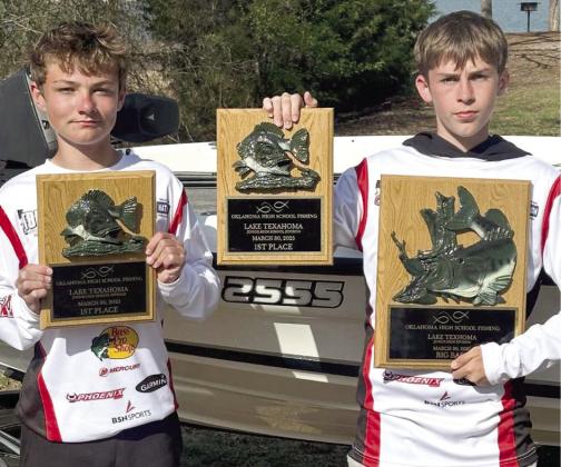 North Rock Creek's Slayton Graham (L) and Rody Wright (R) are team members of the NRC fishing team. They won the junior division of the OK HS FISHING Tournament at Lake Texoma with a stringer of 17.87 lb. Rody had the big bass at 4.77 lbs. out of over a hundred teams. Photo courtesy of Todd Burch
