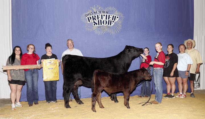 Taycie Baker placed first for her Division 5 Cow/Calf Pair of Ruby and Bubba during the 13th Annual Ron Wayland Memorial Oklahoma Limousin Field Day earlier this month. Her friend Callie Loman, both of Bethel, helped by showing the two-month-old calf. Shown, from left, are Annie Jo Gilbert, Grace Loman, Suzanne Gilbert, Randy Gilbert, Baker, Loman, Morley Griffith, Twana Griffith and Matt Griffith. Photo provided by Suzanne Gilbert