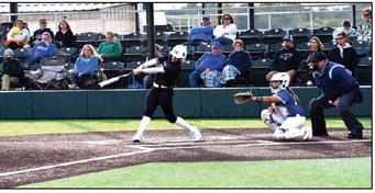 Julie Talton, Countywide &amp; Sun North Rock Creek Alumna, Haley Hacker (batting right), now playing for OBU, sends a hit to left fielder, and Bethel Alumna, Brooklyn Duff (left), who plays for Eastern Oklahoma State. According to the GameChanger App, OBU won 13-4 in the 12-inning matchup.