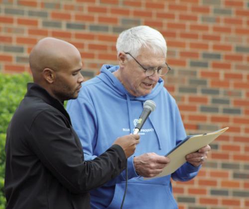 John Bobb-Semple, from Pottawatomie Go (POGO) holds the microphone as Shawnee Mayor Ed Bolt reads a proclamation declaring April 19, 2024 to be United in Strength Day. Countywide &amp; Sun/ Natasha Dunagan