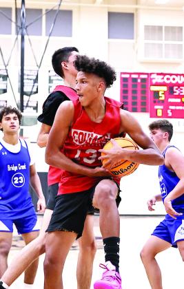 North Rock Creek’s Memphis Burdine gets the defensive rebound in the scrimmage against Bridge Creek.