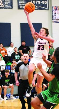 After stealing the ball, Asher’s Mikey Van-Schuyver goes for a layup and is fouled in the Jan. 2 home game with Varnum. File photo