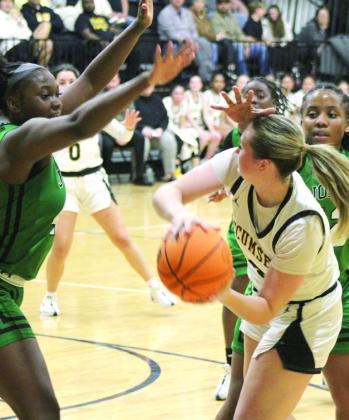 Tecumseh’s Samantha Schweighardt tries to pass to Jadyn Wilson amidst some heavy defense during the Jan. 9 home game with Jones. The Lady Savages lost, 31-41.