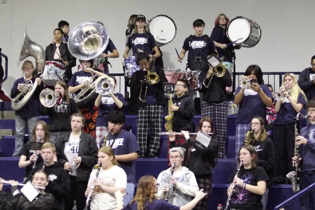 The Shawnee High School Band plays in the stands during the Dec. 17 Lady Wolves home game. Countywide &amp; Sun/Natasha Dunagan