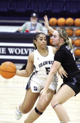 Shawnee sophomore Chrishelle Milum drives toward the basket in the fourth quarter of the Dec. 17 home game against Guthrie.