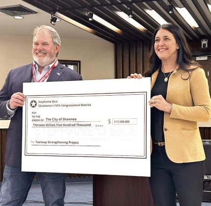Congresswoman Stephanie Bice (right) presents a $13.5 Million check to Shawnee Mayor Eric Stephens. The Community Project Funding Grant - the largest of 15 grant requests approved for Bice - will be used to improve the runway and taxiways at the Shawnee Airport.