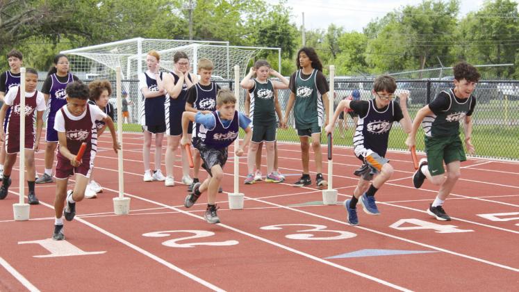 Four sixth-grade boys from Shawnee Middle School start off the Division One Shuttle race.