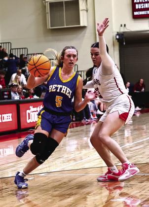 Bethel High Schools Brooklyn Duff drives to the basket past NRC's Morgan Campbell. Photos courtesy of Gowin Photography