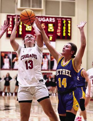 North Rock Creek’s Olivia McRay puts a shot over Bailey Tucker. Photo courtesy of Gowin Photography