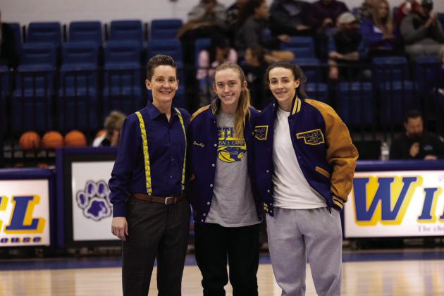 Bethel Head Girls Basketball Coach Tara Satterfield poses with All-State jacket recipients Brooklyn Duff and Parker Stevenson during the home game on Jan. 9. Bethel senior Duff received her jacket for fastpitch softball, and graduate Stevenson received it for 2023 basketball. Photo provided.