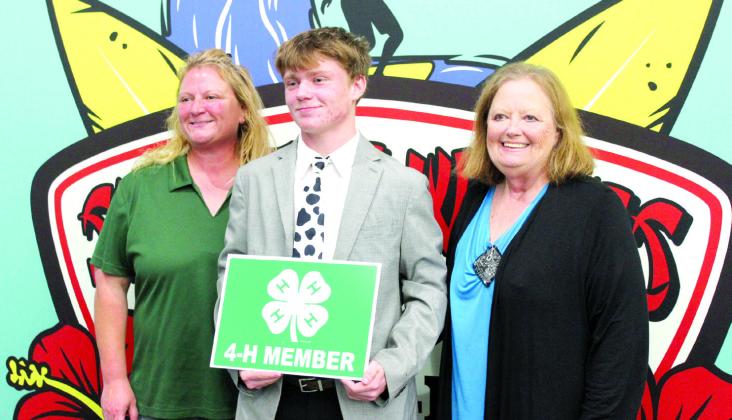 Tecumseh 4-H Club member Taylor Marrs was given the Pottawatomie County 4-H Senior Hall of Fame Award during the 4-H Awards Banquet, held at the North Rock Creek High School Cafeteria on Oct. 23. He is shown with his mother, Sara McGaha, left, and his grandmother, Barbara McGaha. Countywide &amp; Sun/Natasha Dunagan