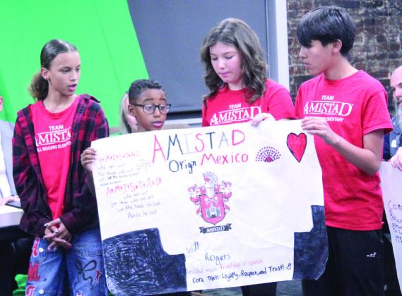 Will Rogers Elementary students Kaylin Burdine, Ayreston Hopkins, Avalynn Madonna and Malachi Pocowatchit speak at the Nov. 3 Shawnee Board of Education meeting about their Ron Clark Academy house, 'Amistad.'