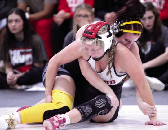McLoud's Addison Adams, front, and Tecumseh's Kylei Gokey think through their next moves in the 140-weight class during the McLoud Tri-Dual on Jan. 8. Gokey won the match by pin. McLoud, Tecumseh and Harrah girls and boys competed at the event. Natasha Dunagan, Countywide &amp; Sun