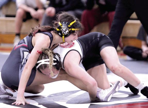 Tecumseh's Lizzy Hernandez tries to balance, as McLoud's Carli Sisco works on taking her to the mat in the 110-weight class during the McLoud Tri-Dual on Jan. 8. Natasha Dunagan, Countywide &amp; Sun