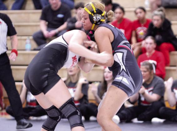 In the 135-weight class, McLoud's Alexus Jones, left, and Tecumseh's Aliah Johnson work on the take-down during the McLoud Tri-Dual on Jan. 8. Natasha Dunagan, Countywide &amp; Sun