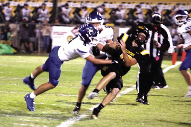Tecumseh junior Wyatt Dodgion is forced out of bounds on a quarterback keeper to make a first down during the first quarter of the Homecoming game against Harrah on Oct. 3. The Savages lost, 23-49. Natasha Dunagan, Countywide &amp; Sun