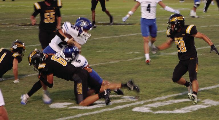 Tecumseh's Cashawn Thompson tackles the Harrah ball carrier in the Oct. 3 game. Savannah Talton, Countywide &amp; Sun