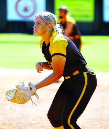 Tecumseh senior Alyssa Norton watches the batter from first base in the Oct. 3 game with Stilwell.