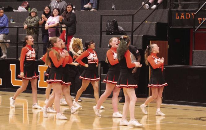 The Maud High School Cheerleaders rally the crowd during the Maud 8-Man Basketball Tournament on Dec. 4.