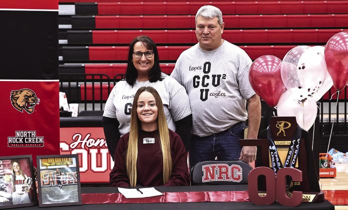 North Rock Creek’s Molly Campbell signed to continue playing softball at Oklahoma Christian University She is pictured with her parents, Maria and Robert Campbell. Photos courtesy of Gowin Photography