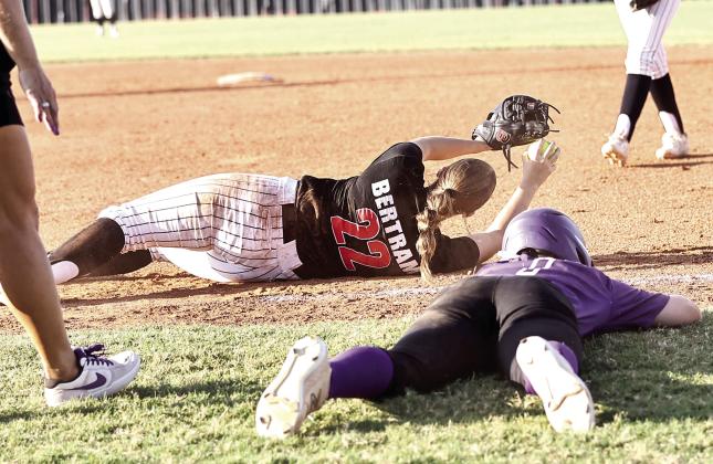NRC's Morgan Bertram gets the out at first to help clench the home field advantage for Regionals in the 3-2, 9th inning victory, over Mannford. Photo courtesy of Gowin Photography