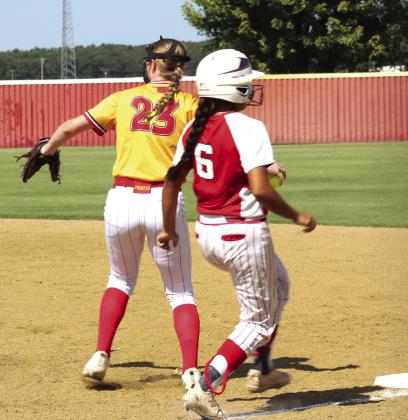 Dale sophomore Brooke Sheline makes the catch at first just before the Texhoma/Goodwell runner reaches the base during the Class 2A Regional Tournament game on Sept. 25. Natasha Dunagan, Countywide &amp; Sun