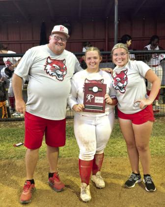 Earlsboro sophomore, Abby McAlister, reached a milestone this season getting over 100 strikeouts and also helping the team advanced to regionals on Sept. 24. Coach Keith Gunter and Maize Wagner are posing with her and their district champion plaque. Photo Provided