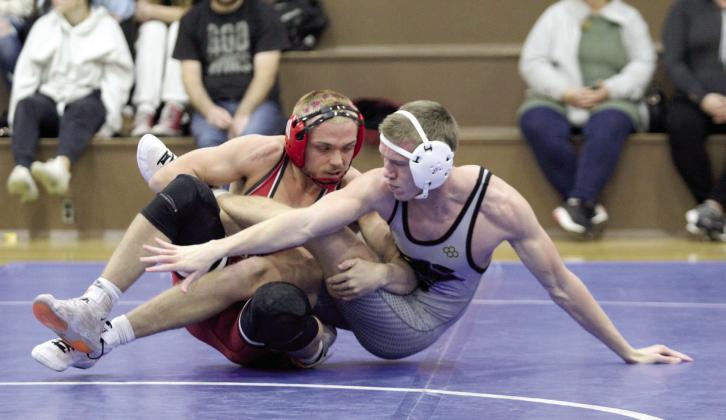 McLoud’s Wyatt Hewer and Bethel’s Zac Griffith compete in the 150 weight class during the Dec. 3 Bethel dual. McLoud won the season-opening event, 57-16. Countywide &amp; Sun/Natasha Dunagan