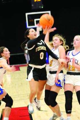 Tecumseh junior Jadyn Wilson tries for a basket but is fouled during the third quarter of Bethel’s First United Basketball Classic on Dec. 10 at FireLake Arena. Also shown, from left, are Bethel’s Parker Stevenson, Brooklyn Duff and Lilly McGehee. Over the three-day tournament, the Lady Savages beat Prague, 42-25, and Perkins-Tryon, 54-28, but lost to the Bethel Wildcats, 33-63, to become the runner-up. Countywide &amp;amp; Sun/Natasha Dunagan