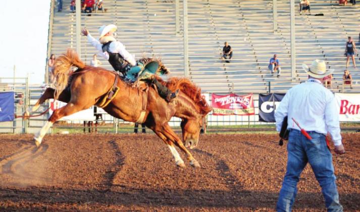 Brayze Schill, of West Columbia, TX, rides in the Bareback Bronc event during the IFYR on July 10 at the Heart of Oklahoma Expo Center.
