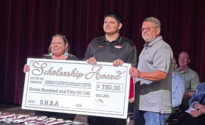 Kaden Deleonrodriguez, center, received the HVAC scholarship. Pictured with Deleonrodriguez is the Shawnee Home Builders Association (SHBA) board member April Grant (left) and SHBA president Greg Sebastian (right). Photo provided by Shawnee Forward