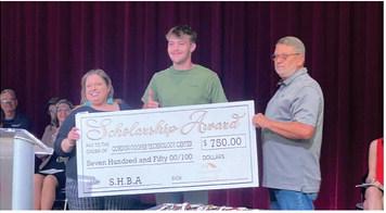 Maddox Gober receives a $750 carpentry scholarship from the Shawnee Home Builders Association. Pictured from left are April Grant, SHBA Board member, Gober, and SHBA President, Greg Sebastian. Photo provided by Shawnee Forward