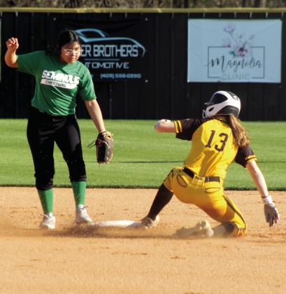 Tecumseh junior Josie Walker slides into second base during the slow pitch softball season opening game against Seminole on March 9. In the first inning alone, the Lady Savages hit at least 11 doubles, and won, 21-0. Natasha Dunagan, Countywide &amp; Sun