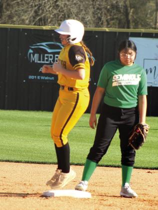 Tecumseh senior Maggie Wilson hops onto second base during the slow pitch softball season opening game against Seminole on March 9. Natasha Dunagan, Countywide &amp; Sun