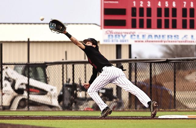 Above: North Rock Creek's Owin Payne stretches to make the out against OCS on Mar. 5. NRC came up short, losing 3-8. NRC Photos by Gowin Photography
