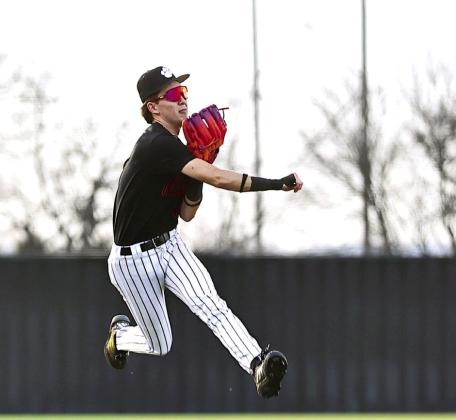 Hasten Conley makes a great throw to first base for the out against OCS on Mar. 5.