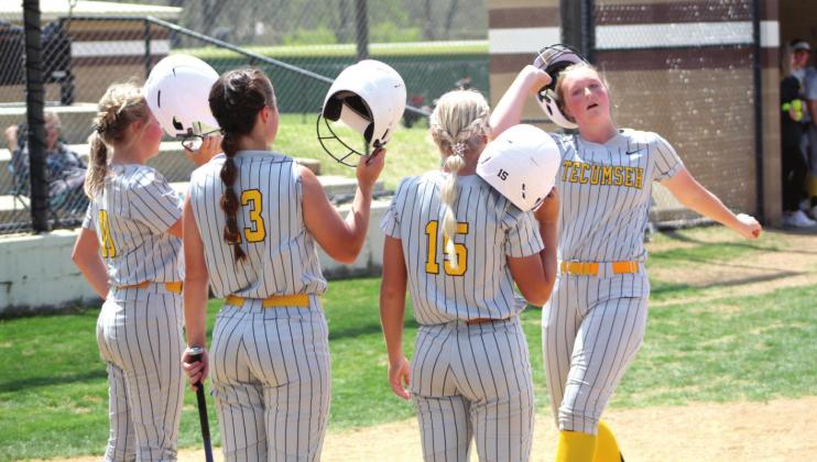 Tecumseh sophomore Samantha Schweighardt removes her helmet to tap it against those of her teammates after hitting a homerun in the third inning of the Dale Slowpitch Festival game against Sterling on April 15 at FireLake Ball Fields. The Lady Savages won in the fourth inning, 10-0. Countywide &amp;amp; Sun/Natasha Dunagan