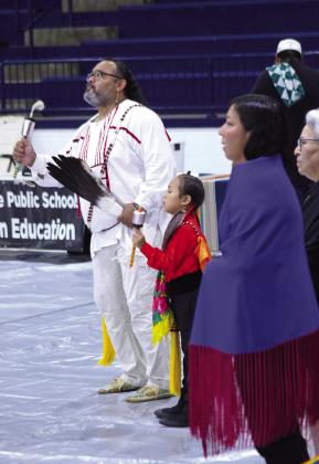 Jason Grass and son Koda Grass, along with two ladies, keep time in the Gourd Dance at the Shawnee and Tecumseh Indian Education Powwow, held at the SHS Performing Arts and Athletic Center. Natasha Dunagan, Countywide &amp; Sun