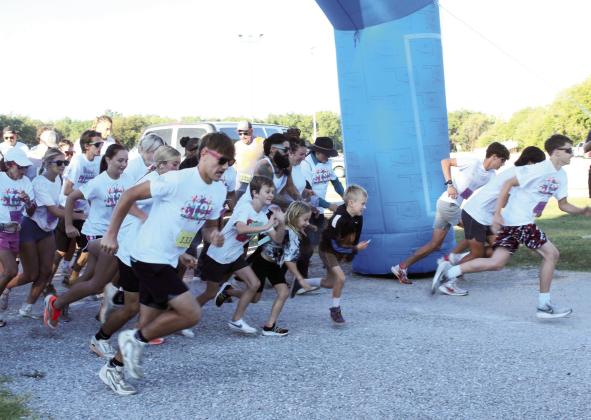Participants in the Fourth Annual House of Hope (HOH) Color Fun Run take off from the starting line at the Citizen Potawatomi Nation Festival Grounds on Oct. 11. HOH Prevention Specialist Kayla Woody said there were 547 people who signed up online. Full caption below. Photos by Natasha Dunagan, Countywide &amp; Sun