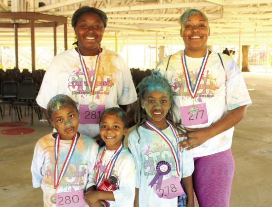 This family made the House of Hope Color Fun Run a chance to have fun together. They are, front row, Zahra, Zen and Zane Brewer, back row, Zoe Collier and Rakail Brewer. Zane Brewer, age 7, won the "Wackiest Dressed" Award. Natasha Dunagan, Countywide &amp; Sun