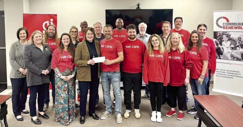 Kathy Laster, Ph.D. President &amp;amp; CEO Avedis Foundation, presents a check to Community Renewal Executive Director Brandon Dyer while staff and Avedis board members join in for the presentation. Photo provided