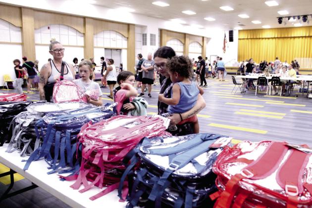 Mission Tecumseh, which is made up of six local churches, offered 500 clear backpacks plus five school supply stations, a prayer station and a craft area at their annual Back to School Bash at the Tecumseh High School W.P. Wood Alumni Center on July 25. They also gave away free hotdogs and watermelon outside. Rev. Anthony LaGrange said they estimate that 750 to 800 people attended the event.