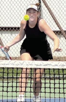 Tecumseh sophomore Kylie Britt keeps her eye on the ball in #2 Singles at the Henryetta Tennis Tournament on April 16. Britt placed fourth. Photo courtesy of Jennifer McKnight