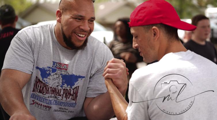 Bryce Talton of Shawnee, left, participates in state-wide arm wrestling practice at Kids Space Park on Sat., March 30. Talton began arm wrestling in 2013 and started entering pro class meets in 2015. Photo courtesy of Mikayla Lorenzen.