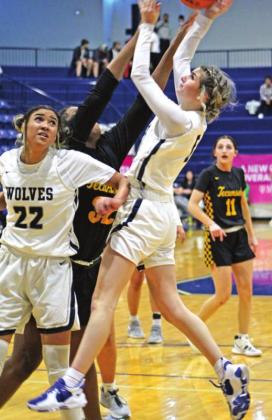 Shawnee’s Ansley Orrell (#5) makes her shot during the home game against Tecumseh on Jan. 14. Also shown, from left, are Amaya Martinez (#22), Shantel Evans (#32), and Kenzli Warden (#11).