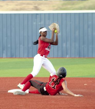 Macomb senior McKenzie Brummett slides into second base as Earlsboro sophomore Zeaonna McGregor makes the catch for the out during the April 2 game played at the BCM Sports Complex in Seminole. The Lady Wildcats beat the Lady Hornets in overtime, 8-7. Photos by Natasha Dunagan, Countywide &amp; Sun. Click on the camera banner ad below to see all our photos from the game!