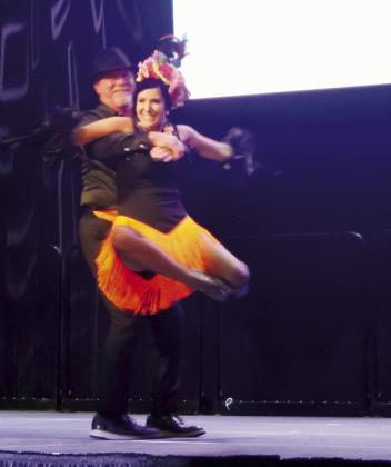 Kevin and Tina Hanna perform in a group dance to “Turn The Beat Around” by Gloria Estefan during the Shawnee Rotary Dancing With Shawnee event Thursday, Sept. 5 at The Grand. Team Hanna won the event.